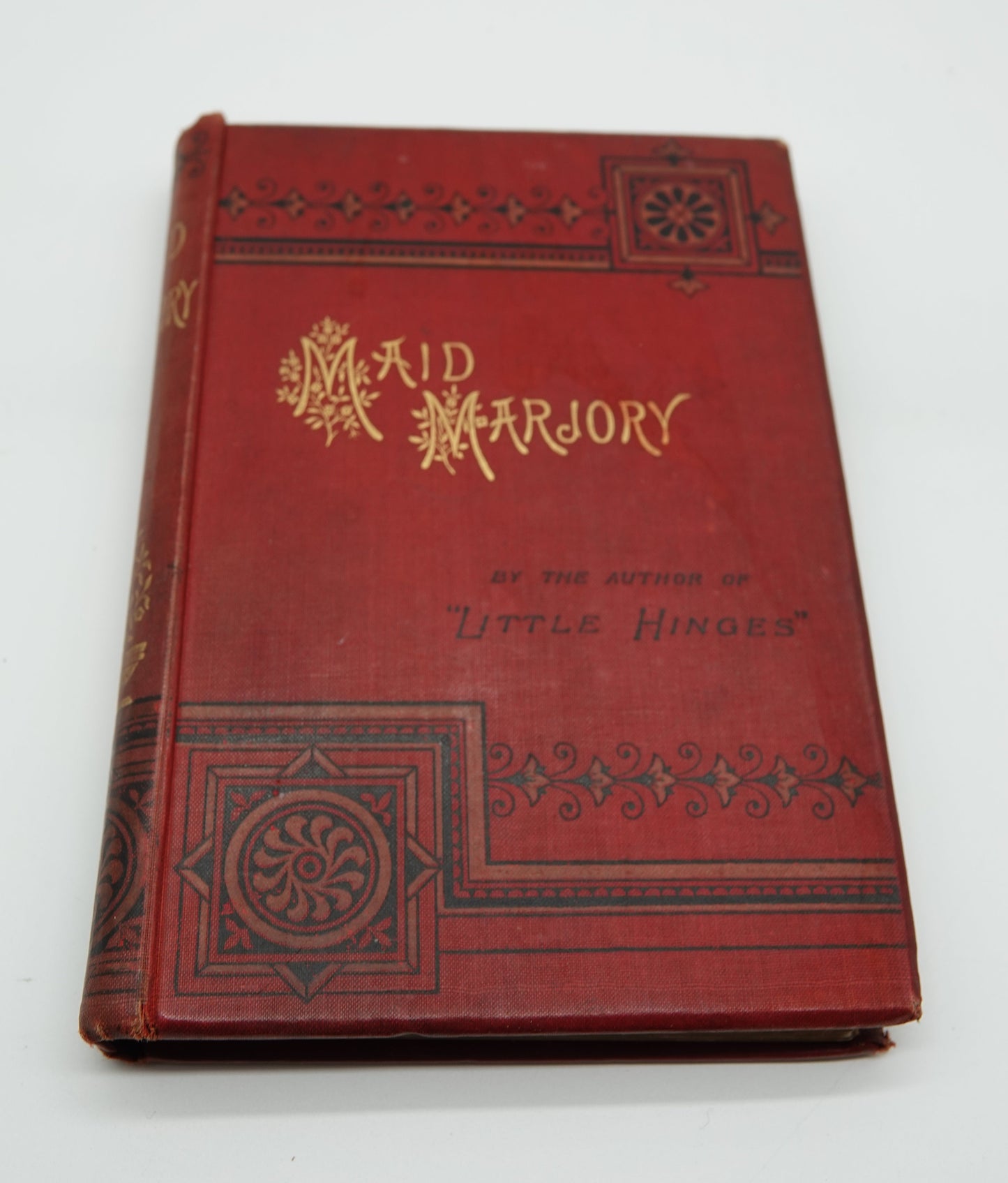 Maid Marjory, a lovely red cloth, gilted and embossed pocket book